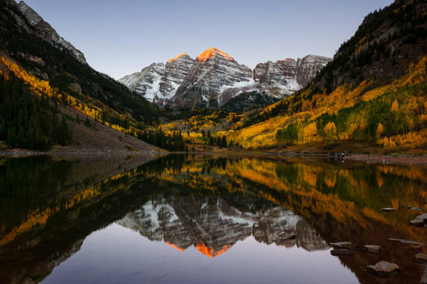 istock Maroon Bells at first glimpse of light 1030584124