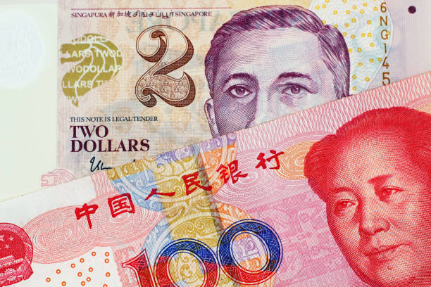 istock A two Singapore Dollar bank note with a hundred Chinese Yuan banknote 1030584656