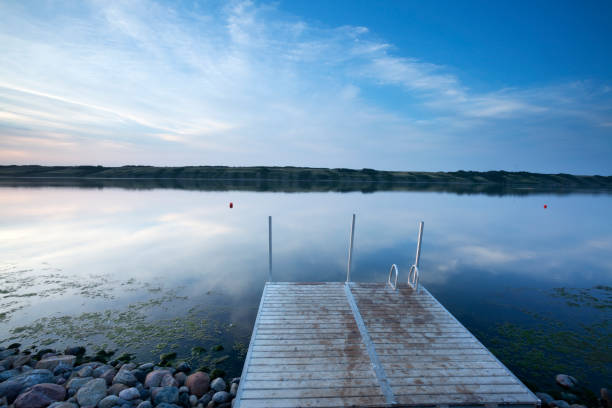 Little Manitou lake is a real gem, about 1.5 hrs from Regina, Moose Jaw and Saskatoon, makes this a ideal get away. This lake was formed by receding glaciers, along with evaporation. It has a specific gravity of 1.6, about five times the salt of the oceans water. Its funny to watch inexperienced people rent canoes, the canoes ride a lot higher than in a normal lake and lots of times end up tipping the canoe over, don't bring your cellphone or watch or camera out there, Basically its pretty hard to drown. It has been known to have great healing powers with the Natives for years. Canada`s own Dead Sea, about half the salinity of the Great Dead Sea. Image taken from a tripod.