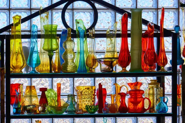 shelf of colorful glass bottles