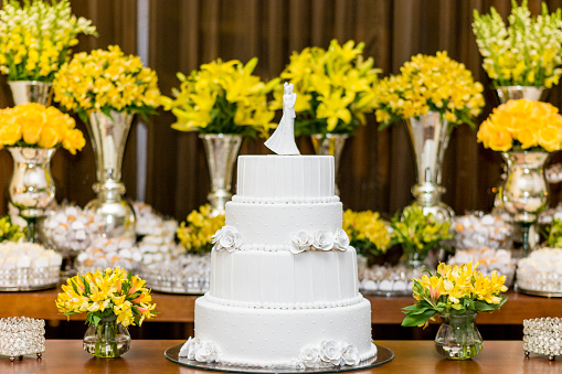 Table decorated with wedding cake.