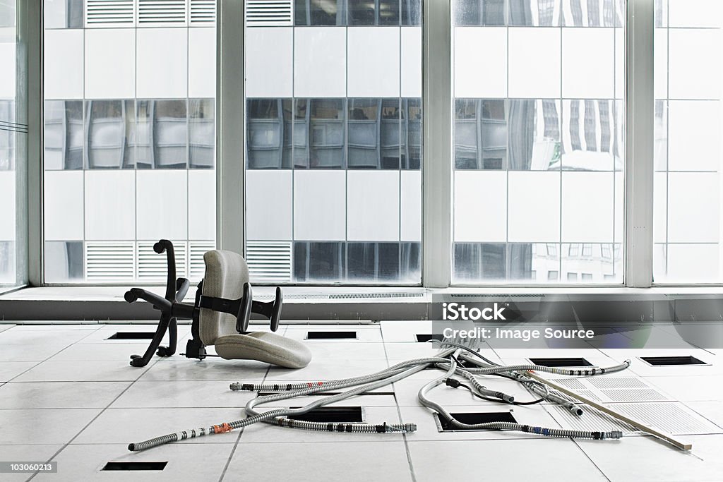 Office chair and cables on floor  Bankruptcy Stock Photo