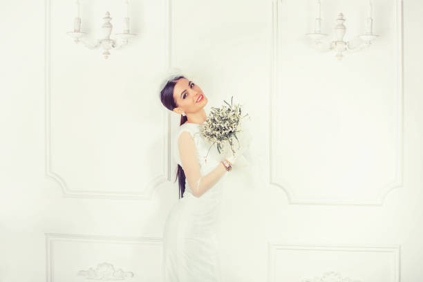 istock Beautiful modern bride with bouquet 1030605340