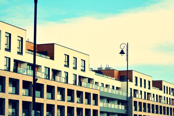 istock Modern apartment building exterior. Retro colors stylization 1030607930