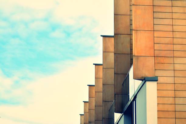 istock Modern apartment building exterior. Retro colors stylization 1030610356