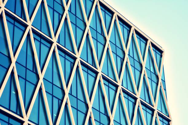 istock Modern office building on a clear sky background. Retro stylized colorful tonal filter effect 1030610674