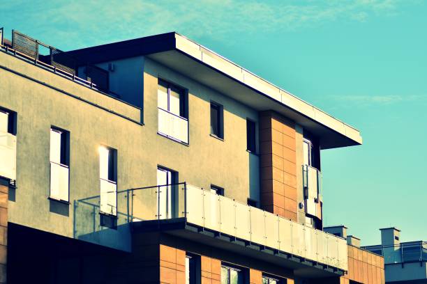 istock Modern apartment building exterior. Retro colors stylization 1030612930