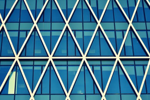 istock Modern office building on a clear sky background. Retro stylized colorful tonal filter effect 1030612966