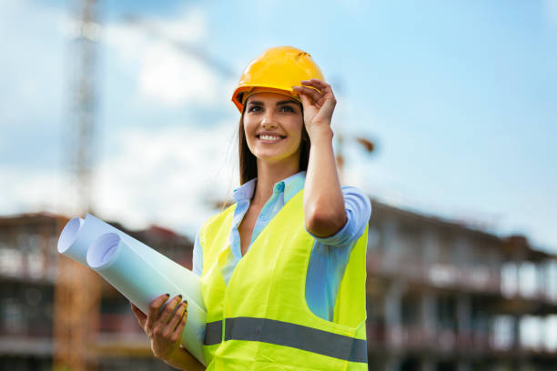 Young female worker on consturction site Portarit of a young female construction architect civil engineer stock pictures, royalty-free photos & images