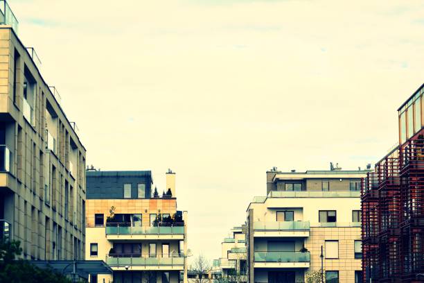 istock Modern apartment building exterior. Retro colors stylization 1030615458