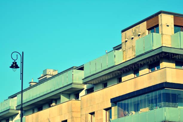 istock Modern apartment building exterior. Retro colors stylization 1030615794