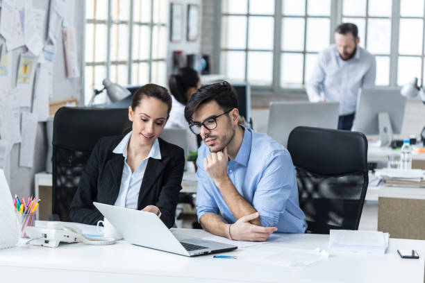 istock Female and male coworkers at work 1030623558