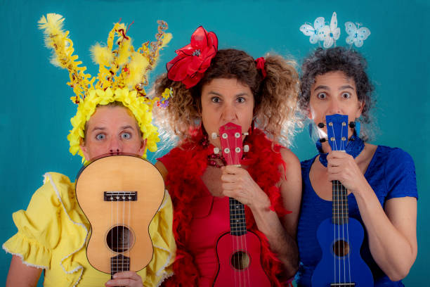 istock Three clowning women play and sing. 1030629520