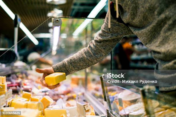 Close Up Person Hand Buying Cheese In Store Stock Photo - Download Image Now - Cheese, Supermarket, Delicatessen