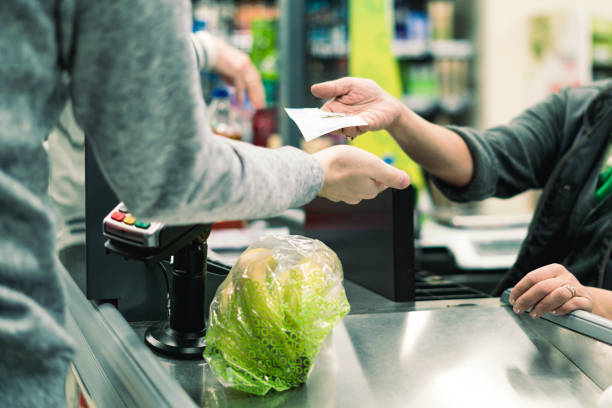 abstract consumer in food store cashbox - store retail supermarket checkout counter imagens e fotografias de stock