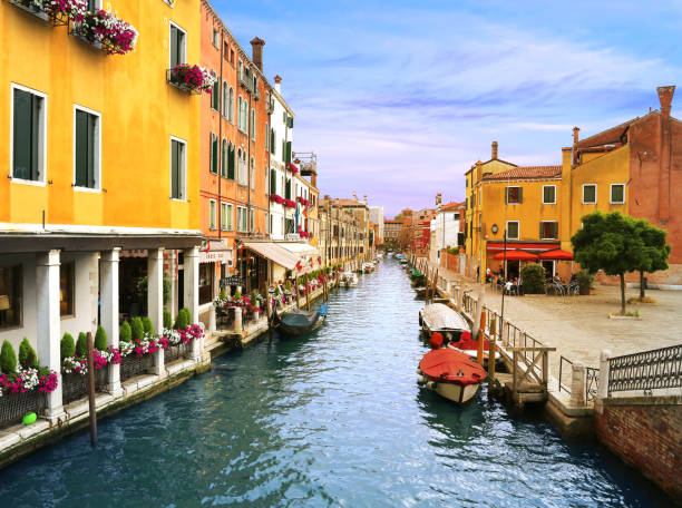 Charming Venetian street lined with trattoria and hotel stock photo