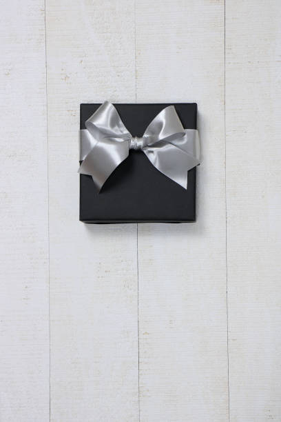 istock gift, gift box, paper wrap, gift wrap, ribbon, event, anniversary, black Friday, black, silver, Christmas, pattern, texture, pop 1030657836