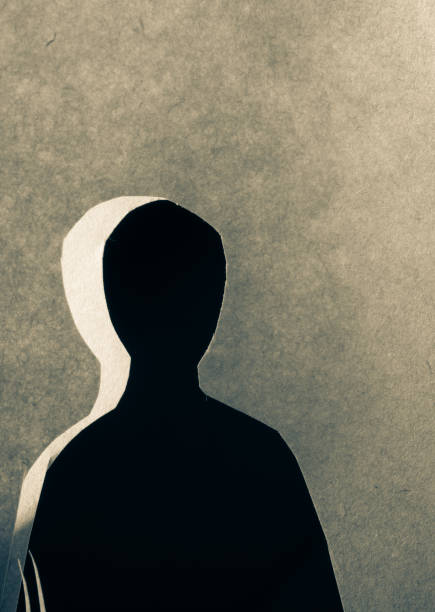 istock Man shape cut out of paper in hand 1030680730