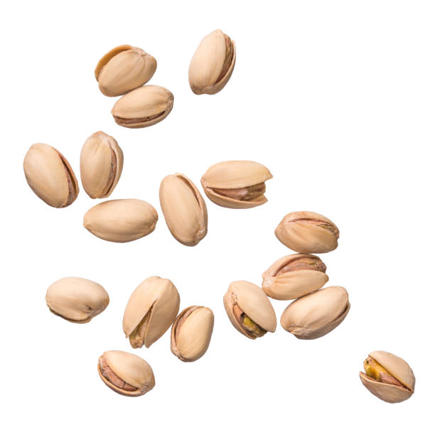 istock Pistachio nuts isolated on white background. Levity kernels 1030686118