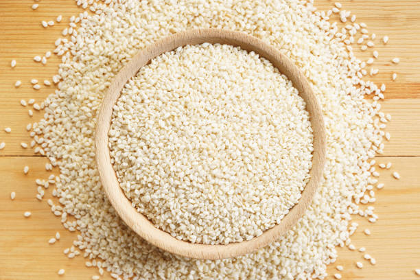 istock White sesame seeds on wooden background 1030686902
