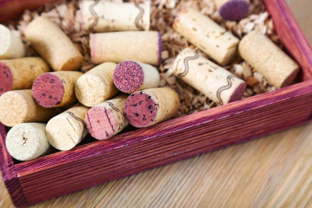 istock Used corks close up in red wooden box. 1030689112