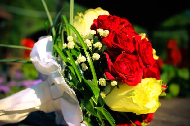 Wedding, red flowers and rings Bridal bouquet accessories.