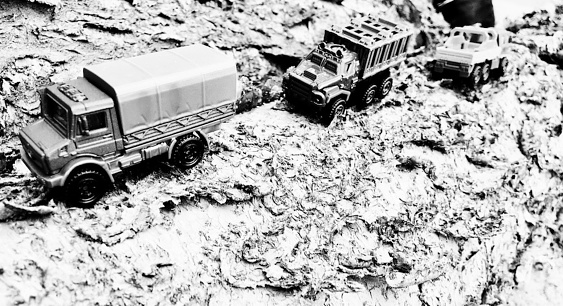 Seen here are 1:64 (around 2.5 inch) scale models of the trucks used in the movie Jurassic World