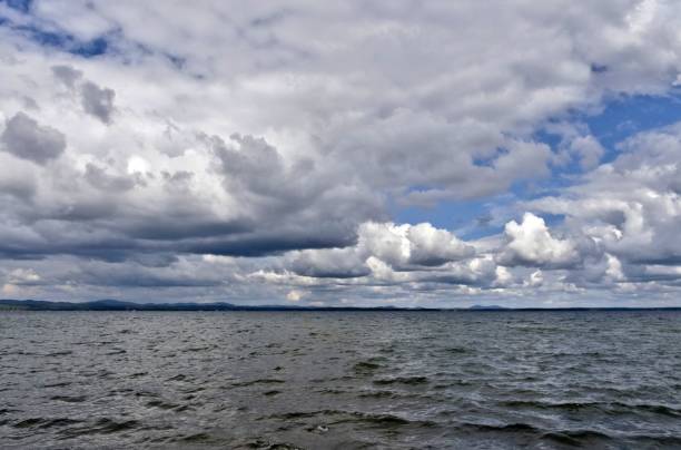 istock day lake in gray-white cloudy weather 1030711310