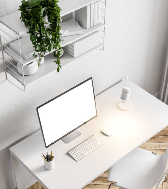 istock White home office, screen and shelves, top view 1030726014