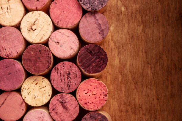 istock Wine corks background, overhead photo of red and white wine corks with copyspace 1030728710