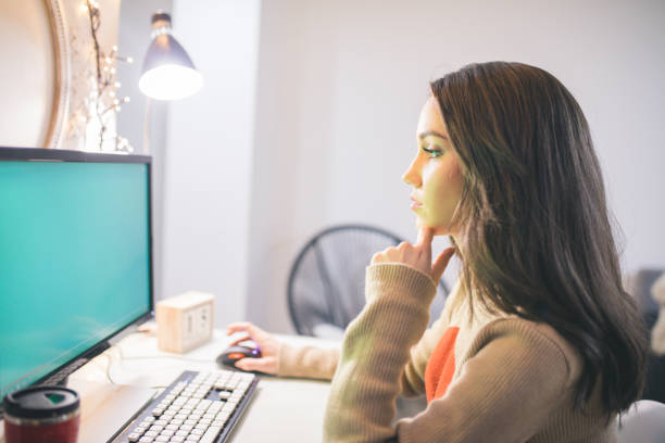 istock Young woman working on laptop in the office 1030734130