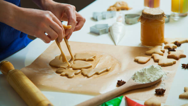 istock Cooking Christmas gingerbread cookies decorating for new year celebration 1030737338