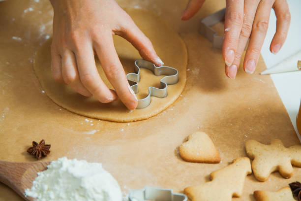istock Cooking Christmas gingerbread cookies decorating for new year celebration 1030737424