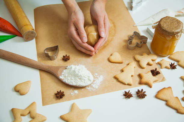 istock Cooking Christmas gingerbread cookies decorating for new year celebration 1030737524
