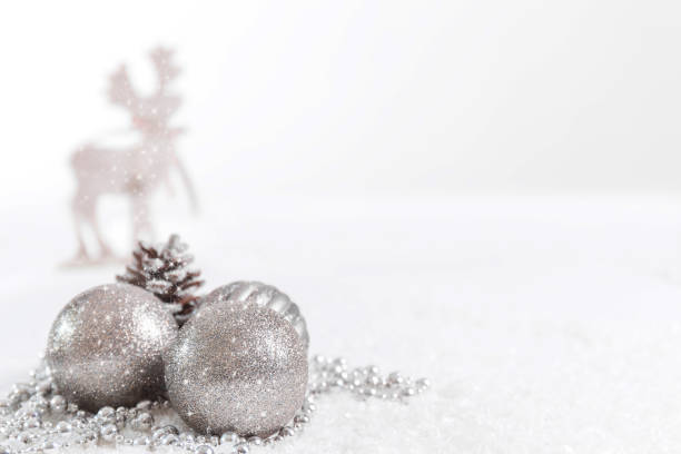 istock Christmas balls and fir branches with a reindeer against a white background 1030738024
