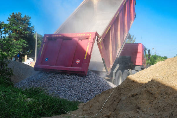 istock truck pours sand on the construction site 1030744226
