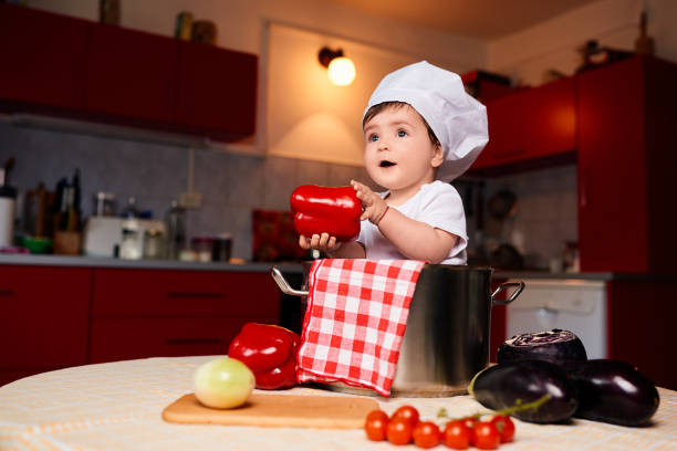 istock cute baby in the kitchen 1030744602