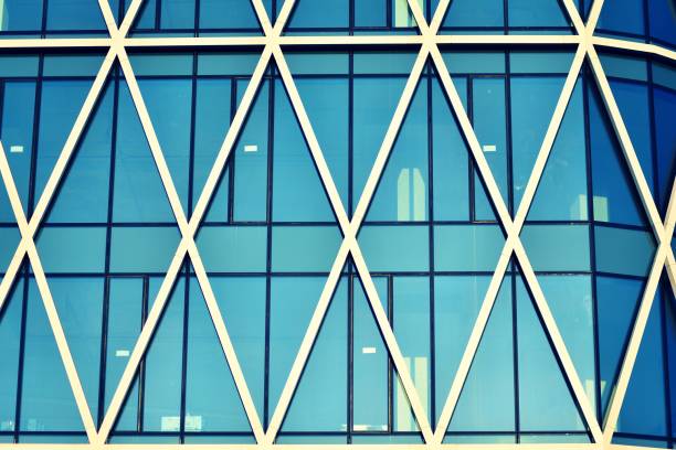 istock Modern office building on a clear sky background. Retro stylized colorful tonal filter effect 1030747236