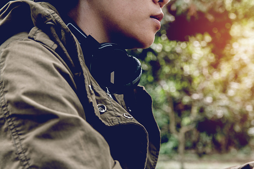 Close-up Man in shirt with heatset sitting on forest, Camping concept