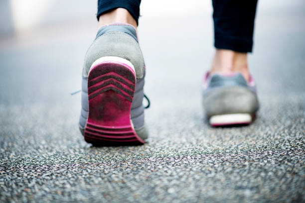 istock Woman walking on a road 1030748210
