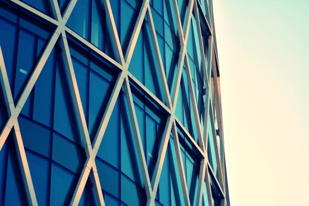 istock Modern office building on a clear sky background. Retro stylized colorful tonal filter effect 1030748260