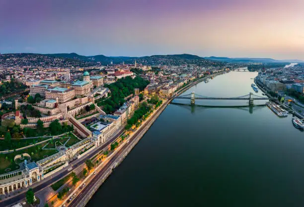 Budapest, Hungary - Panoramic aerial view of Budapest. This view includes Buda Castle Royal Palace, Matthias Church, Fisherman's Bastion and Szechenyi Chain Bridge at sunset with colorful sky