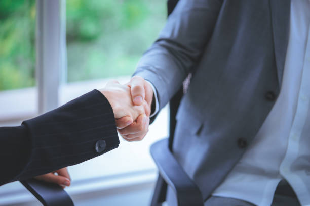 istock Happy business man with confidence handshake with partner 1030751506