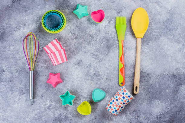 istock Colorful Rainbow Kitchen utensils on grey concrete table background. Top view, copy space 1030751708