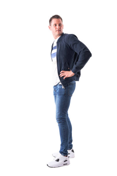 istock Profile view of handsome young man in bomber jacket looking back over the shoulder. 1030751876