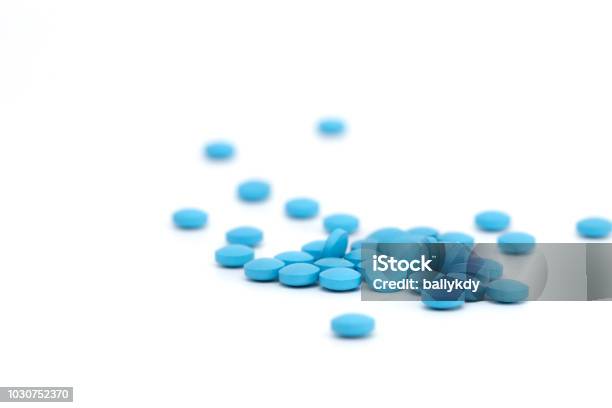 Blue Pills On White Background Stock Photo - Download Image Now - Pill, Blue, White Background