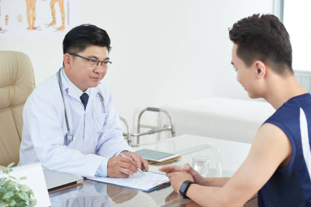 istock Asian man consulting with doctor 1030755768