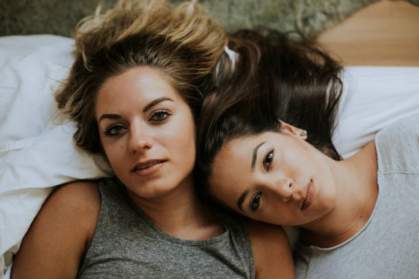 istock Lesbian couple together in bed 1030759824