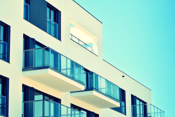 istock Modern apartment building exterior. Retro colors stylization 1030763130