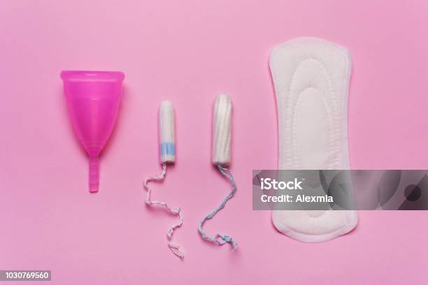 Pad Menstrual Cup Tampon On A Pink Background Stock Photo - Download Image Now - Menstruation, Tampon, Sanitary Pad